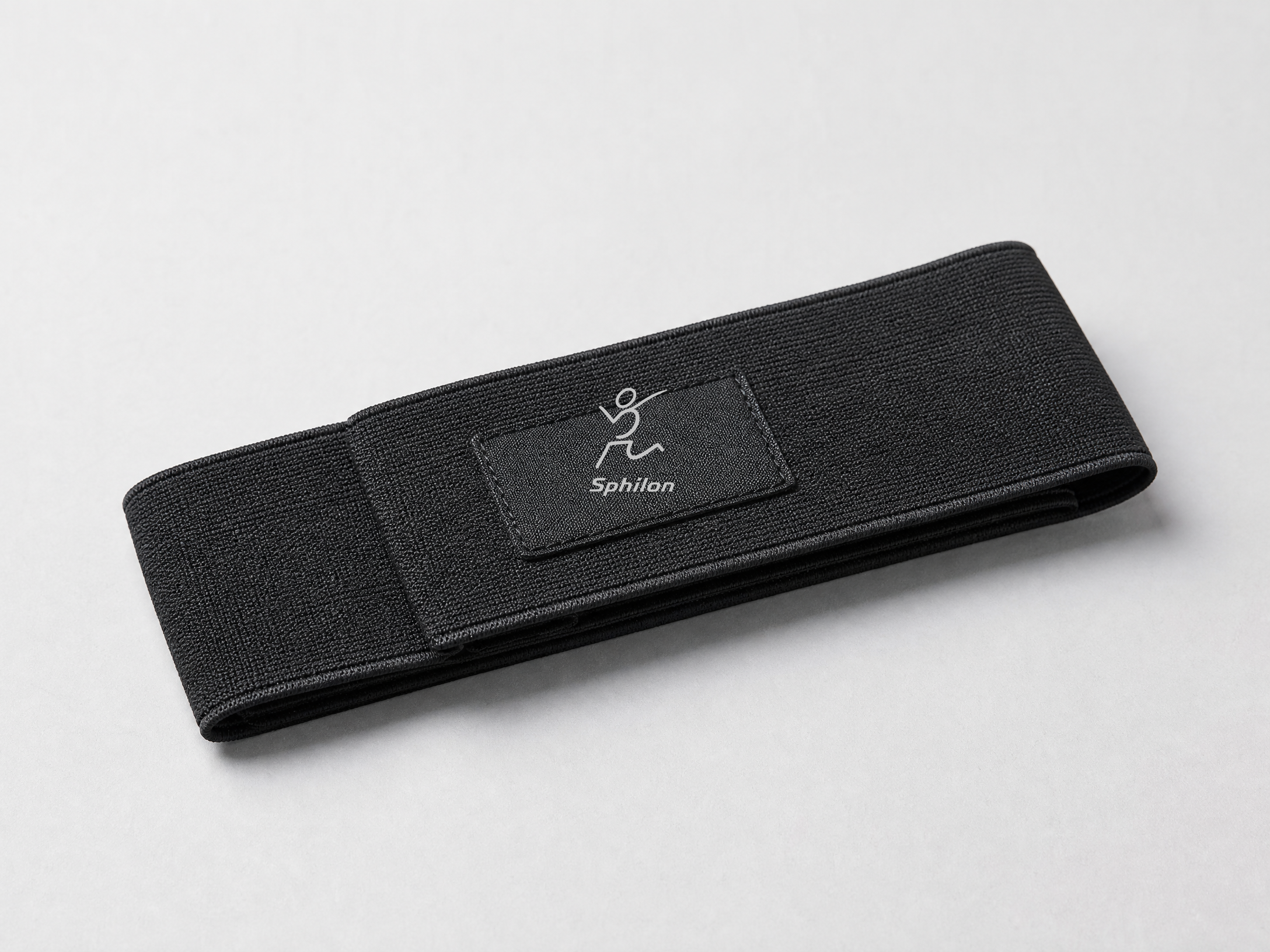 Stretch Strap Carry Sleeve — Elastic technical knit with central black woven label